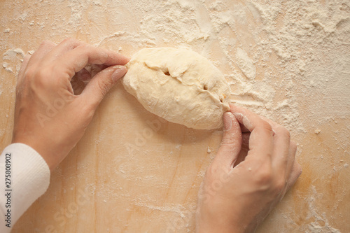 Close-up, homemade cooking. Woman sculpts a pie