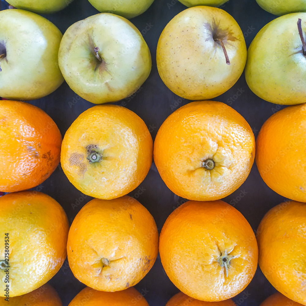 table with oranges and apples