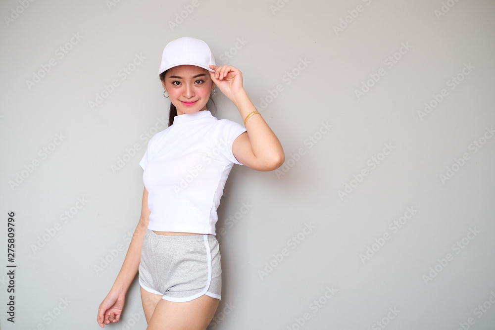 Asian girl in sportswear with happy expression. Asian girl in sportswear with happy expression.