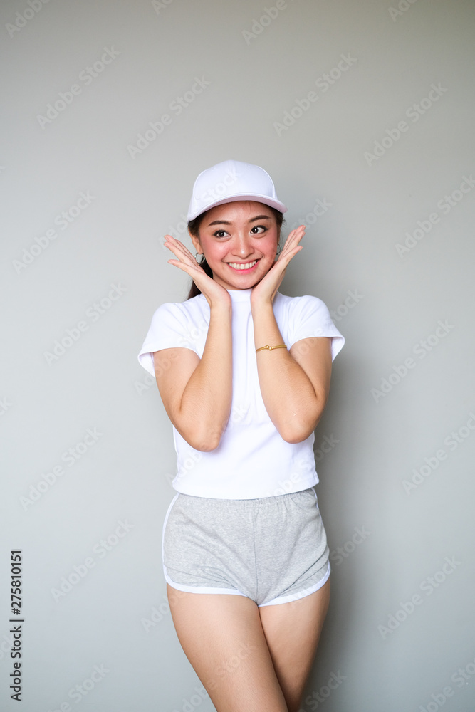 Asian girl in sportswear with happy expression. Asian girl in sportswear with happy expression.