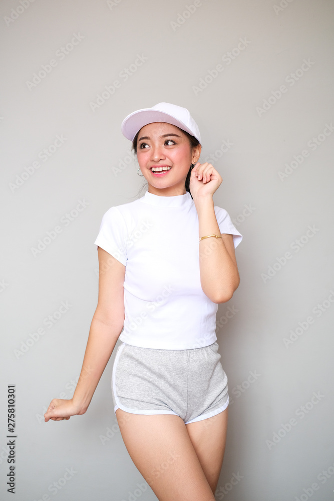 Asian girl in sportswear with happy expression. Asian girl in sportswear with happy expression.