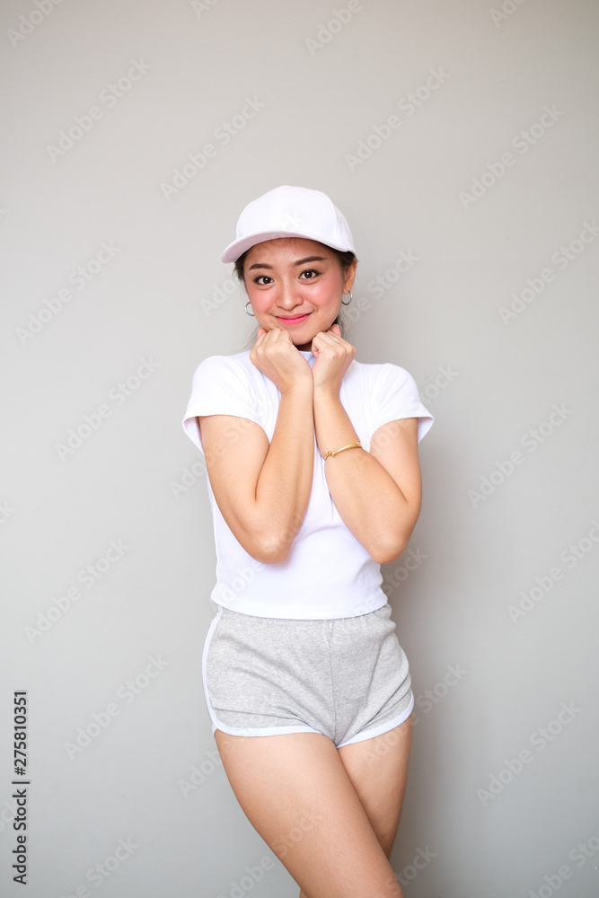 Asian girl in sportswear with happy expression. Asian girl in sportswear with happy expression.
