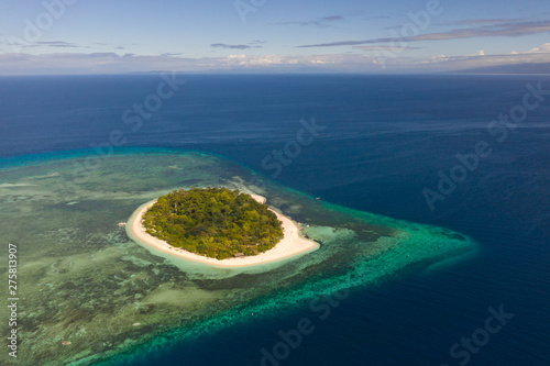 Mantigue Island  Philippines. Tropical island with white sandy beach and coral reefs. Seascape  view from above.