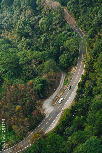 Road with cars running that view from Gondola lifts in the area of Sun Moon Lake Ropeway in Yuchi Township  Nantou County  Taiwan.