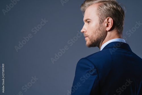 elegance caucasian Successful businessman  with beard close up wear formal suit tie grey background