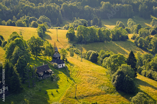 Aerial view of castle ruins Tolstejn with beautiful view to a chapel in Luzicke hory. Czech republic photo