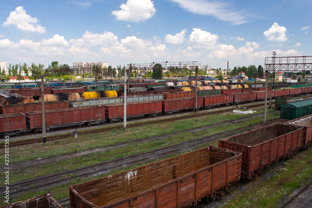Freight trains on city cargo terminal. Railways in train parking. Arain arrived at the station. Cargo train platform with freight train container at depot in port use for export logistics background.