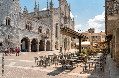 View of Duomo square with traditional Italian street cafe in the historic center of Como, Italy. photo