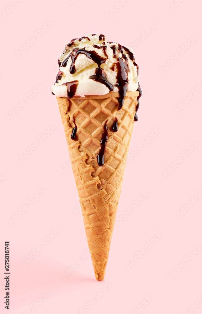 White ice cream ball in a Waffle Cone on a pink Background. Fruit ice cream in a waffle cone. White ice cream ball in a Waffle Cone on a pink Background. Fruit ice cream in a waffle cone.