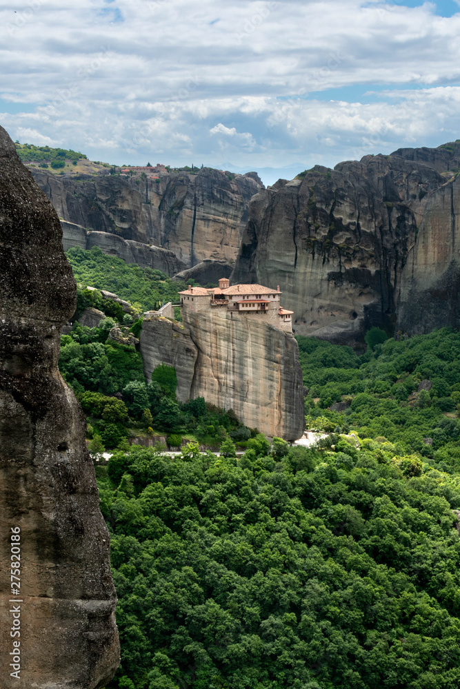 Secluded Greek monastery on top of rock cliff v8