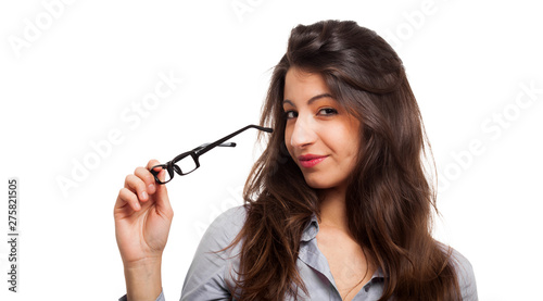 Smiling woman holding a pair of glasses