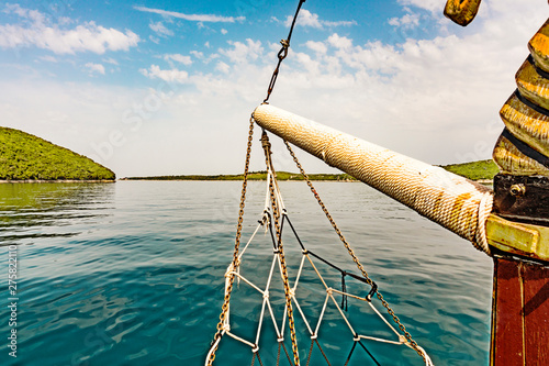 view on Limksi Canal, Lim Fjord, through prow and net of a boat. Croatia