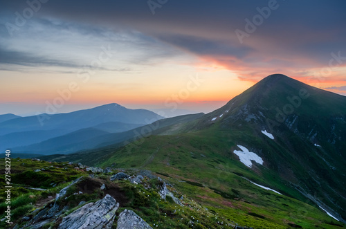 Misty sunset in Carpathian mountains viewing Hoverla and Petros