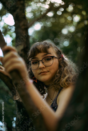 Portrait of teenage girl in a tree 