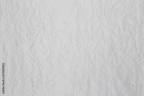 Elegant white shiny fabric with corrugated fabric texture