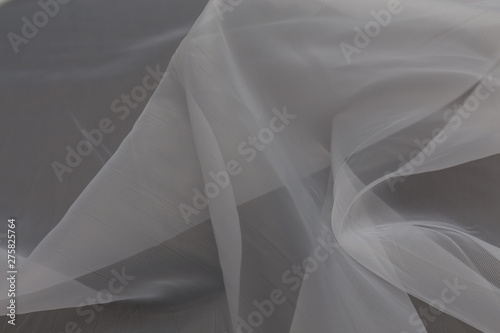 Beautiful close up of white silk fabric with textile texture background