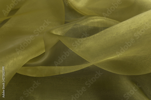 Obraz na plátne Beautiful closeup of yellow sateen fabric with textile texture background