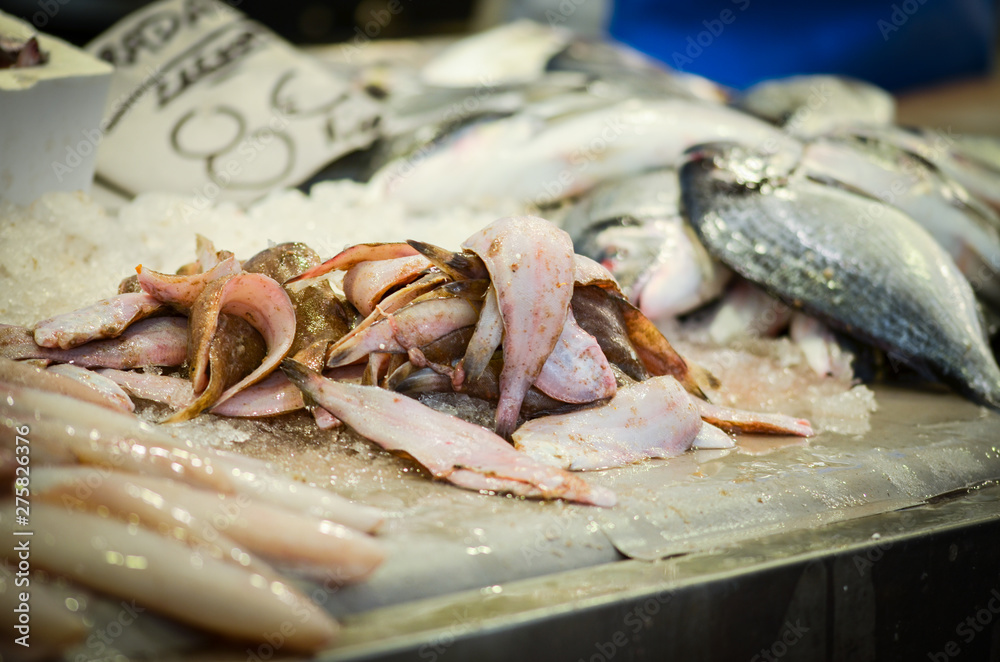 fresh seafood within the fish market in Spain - octopus, shells, shrimps, fish, oysters, lobster 