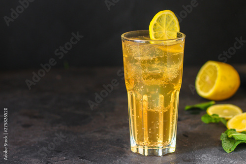 lemonade with lemon and ice (cooling drink). top food background. copy space
