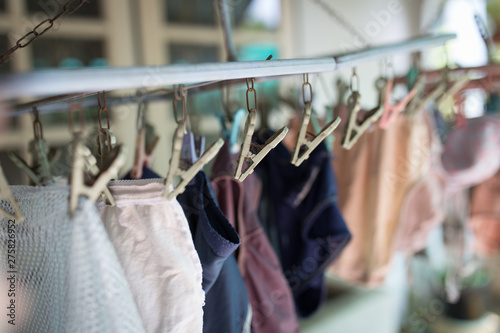 Clothes pegs or clothespins is hanging the underware on a cord