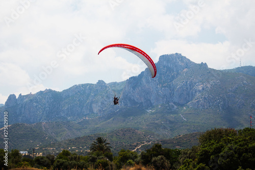 Man paragliding from the mountain