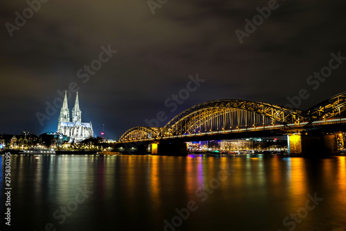 Cologne Cathedral and Hohenzollern Bridge at night in Cologne, Germany
