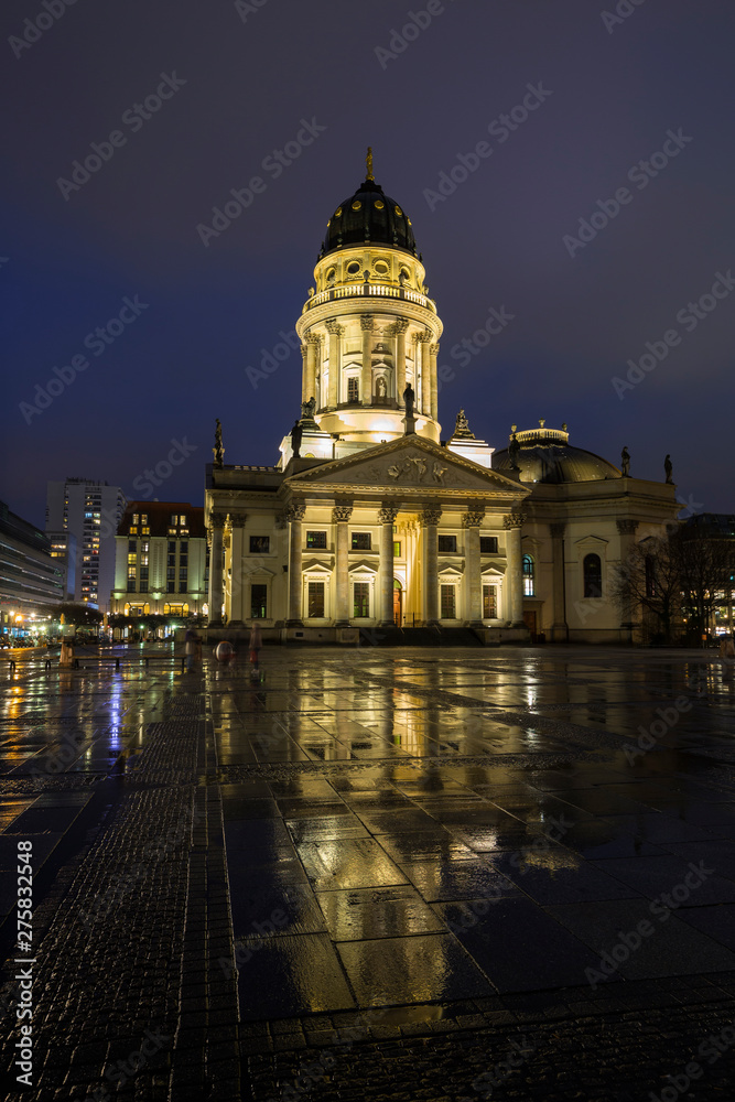 Illuminated Neue Kirche (Deutscher Dom, German Church or German Cathedral) in Berlin, Germany, at the Gendarmenmarkt Square in Berlin, Germany, in the evening.