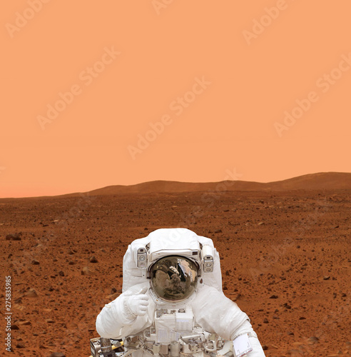 Astronaut on the planet surface. The elements of this image furnished by NASA. photo