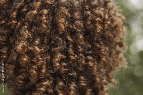 texture of male curly hair close up. perm for men. stylish hairdo
