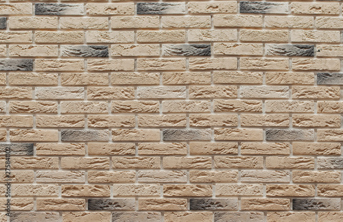 Background of masonry brown and beige clinker bricks on the wall, which are used in the repair of premises