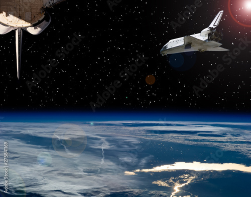 Shuttle flies in space. Other spaceship goes anywhere.  The elements of this image furnished by NASA.