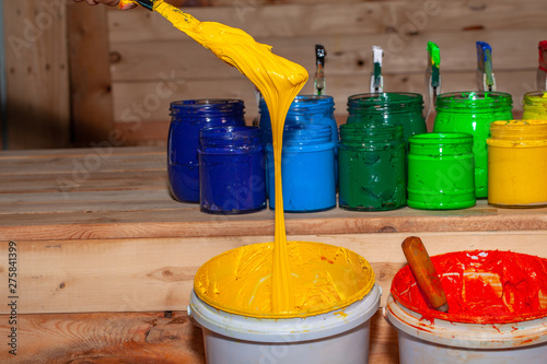 yellow ink of  screen printing tee shirt in screen printing tee shirt factory store. photo