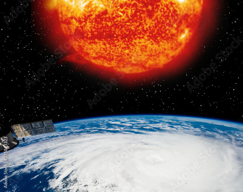Earth planet and burning sun above it. The elements of this image furnished by NASA.