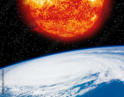 Earth planet and burning sun above it. The elements of this image furnished by NASA.