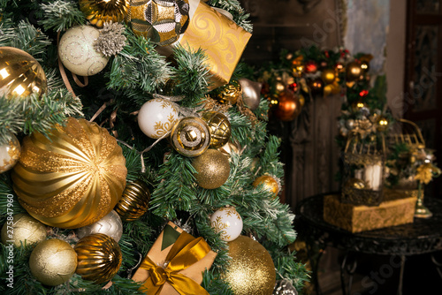 Golden and white balls on Christmas tree