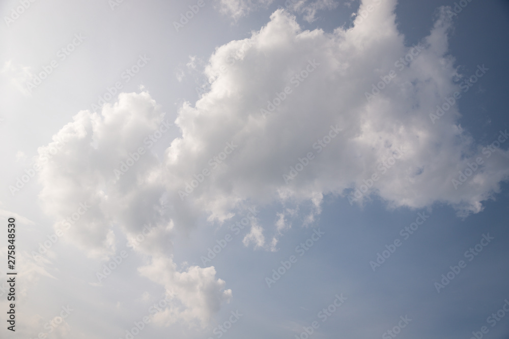 Scenic sky. Beautiful white soft fluffy clouds on a blue sky background Scenic sky. Beautiful white soft fluffy clouds on a blue sky background
