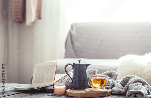 Cozy autumn still life with a cup of tea photo