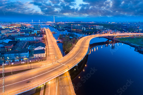 Saint Petersburg. Russia. Betancourt bridge. Petersburg express road in the evening panorama. Illuminated speed highway. Petersburg transport network.  Neva River. Cities of Russia.