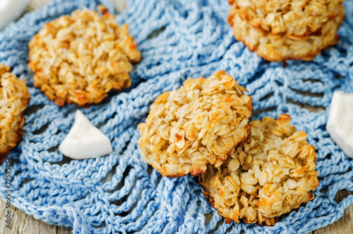 Oatmeal coconut cookies on a wood background