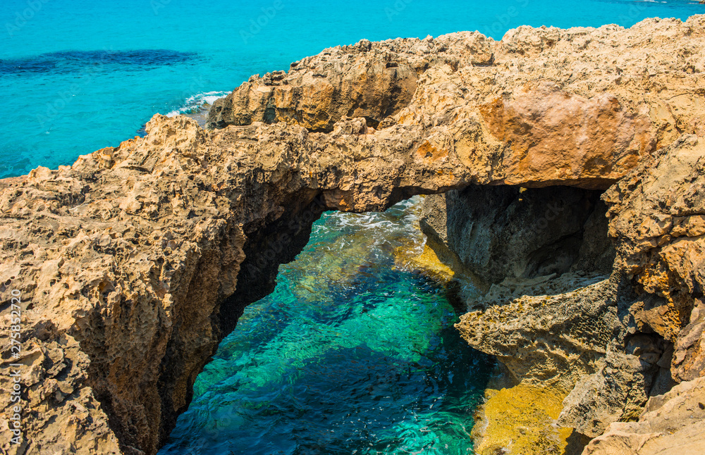  pristine seascapes with crystal clear blue water and yellow rocks in Ayia Napa, Cyprus