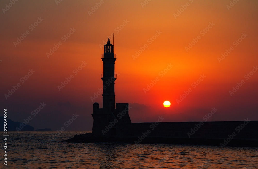 Lighthouse of Chania at summer sunset , Crete , Greece. Travel background