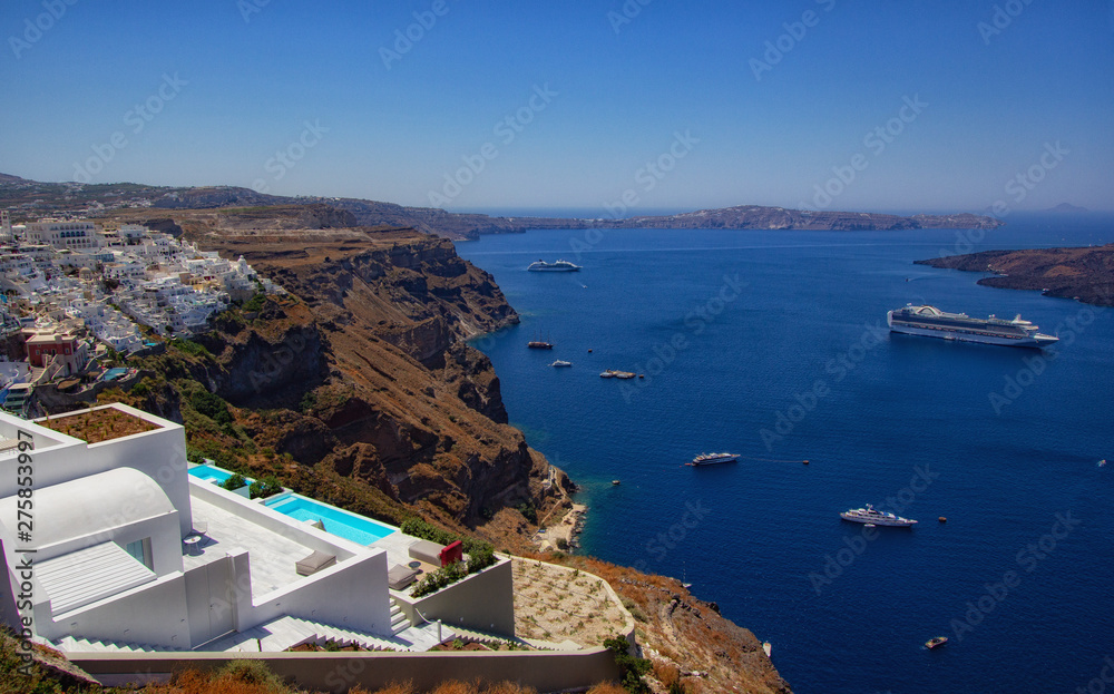 Beautiful view of Santorini island from Thira. Luxury hotels, cruise ships, and old town on a background