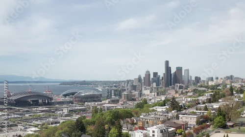 Cinematic Drone Aerial Approaching Seattle Usa Downtown Buildings Over Parks and City Road Car Traffic photo