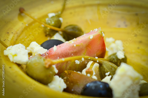 artisanal greek salad - fresh vegetables, goat cheese & spices