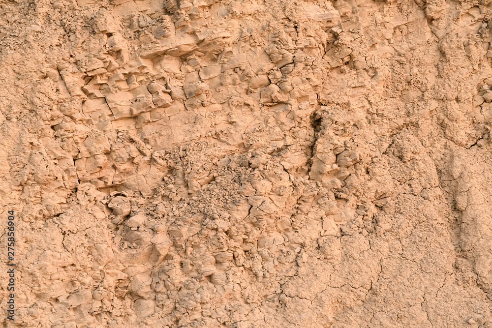 Wall of clay with a huge amount of small crumbs