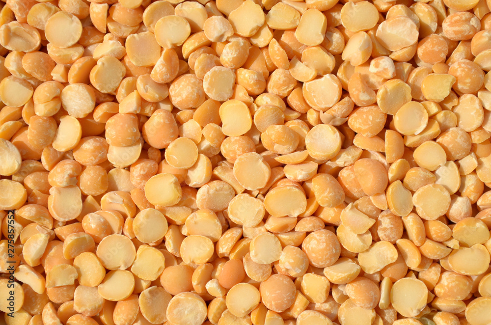 Dry split peas as a background texture. Close-up, top view