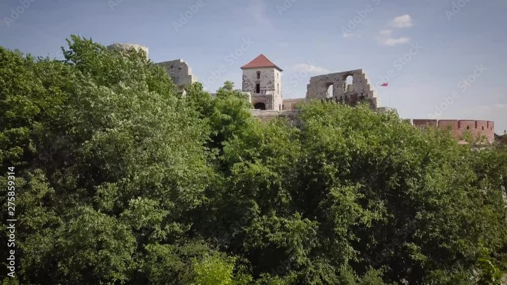 Beautiful historic castle ruins on a green hill. Ruins of Tenczyn Castle in Rudno, Poland. Beautiful historic castle ruins on a green hill. Ruins of Tenczyn Castle in Rudno, Poland.