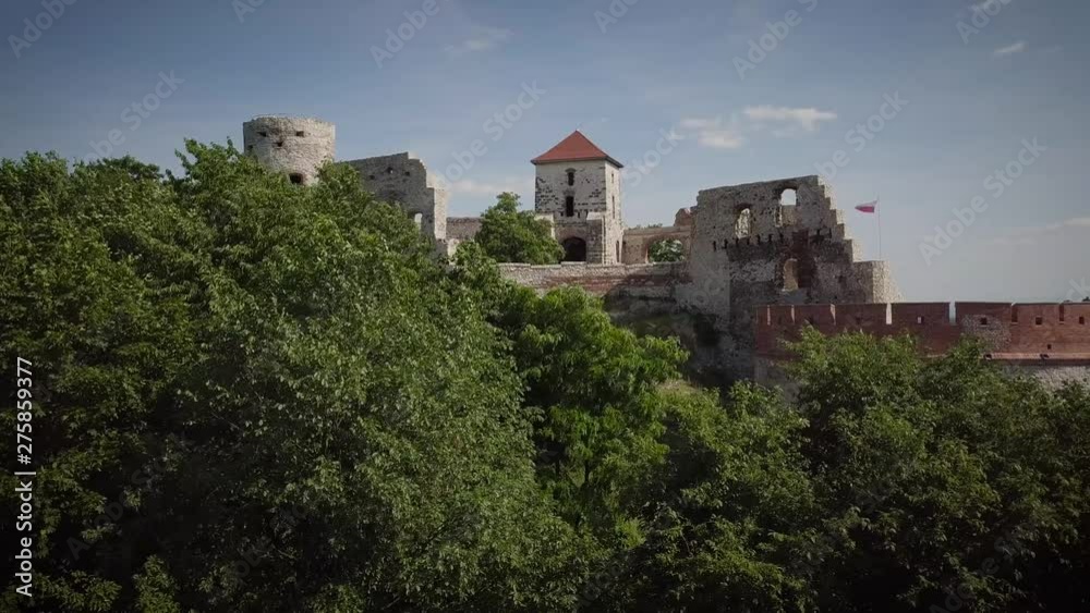 Beautiful historic castle ruins on a green hill. Ruins of Tenczyn Castle in Rudno, Poland. Beautiful historic castle ruins on a green hill. Ruins of Tenczyn Castle in Rudno, Poland.