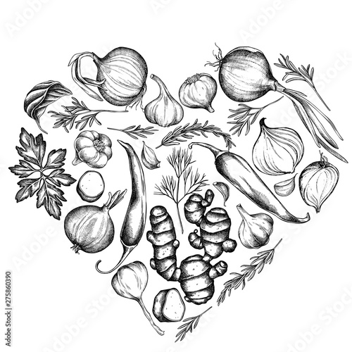 Heart floral design with black and white onion, garlic, pepper, greenery, ginger, basil, rosemary