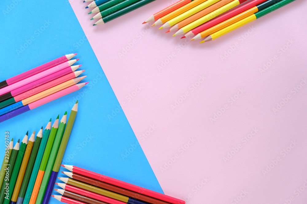 Creative flat lay back to school concept with colored pencils on blue and pink background. Minimal concept art. Top view, copy space. Creative flat lay back to school concept with colored pencils on blue and pink background. Minimal concept art. Top view, copy space.